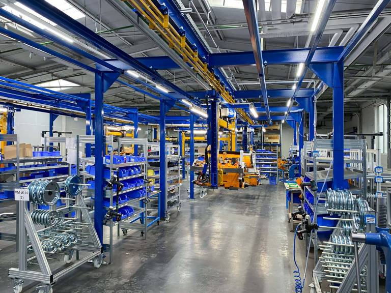 AS-Motor factory, new product line is open: AS 1000 Ovis EVO RC. Wide shot of the assembly line