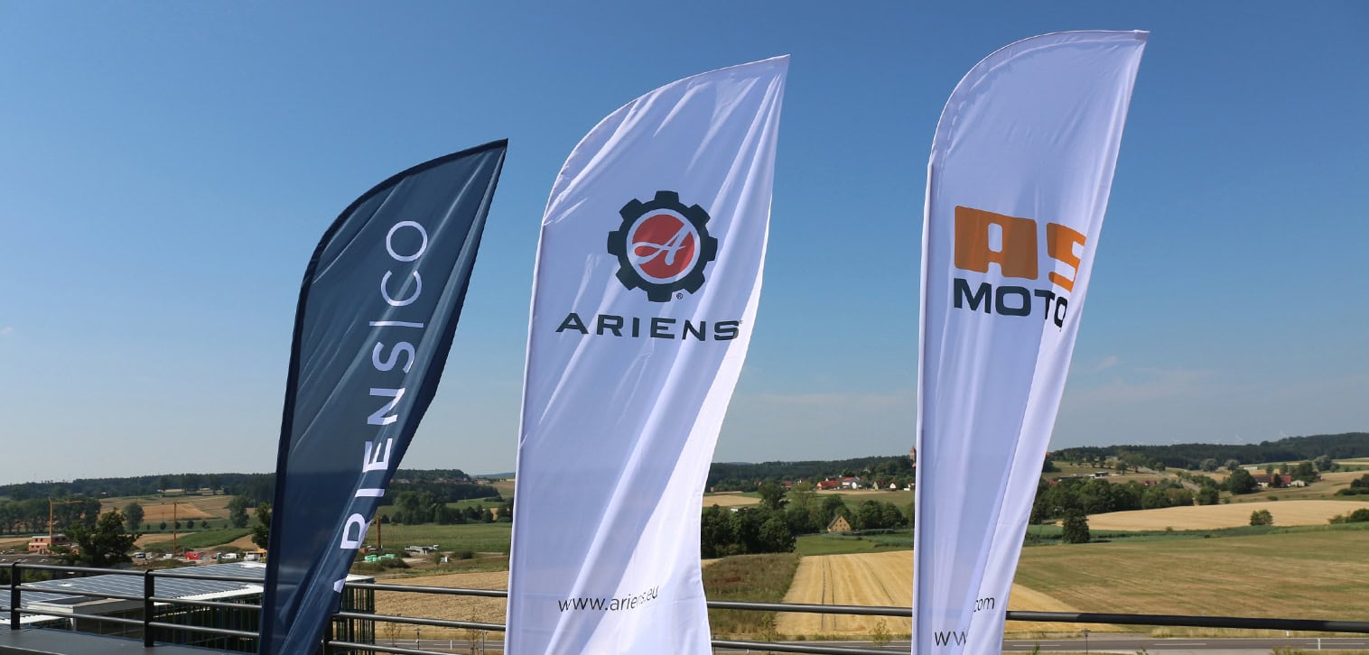 AriensCo EMEAA: Close up of flags of: AriensCo, Ariens and AS-Motor