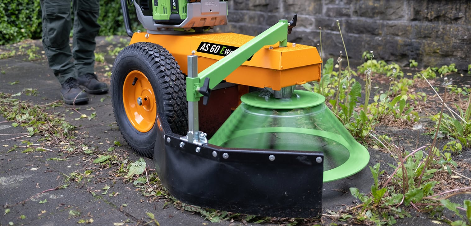 AS-Motor WeedHex, chemical weed removal option. Removing weeds on a concrete parking lot